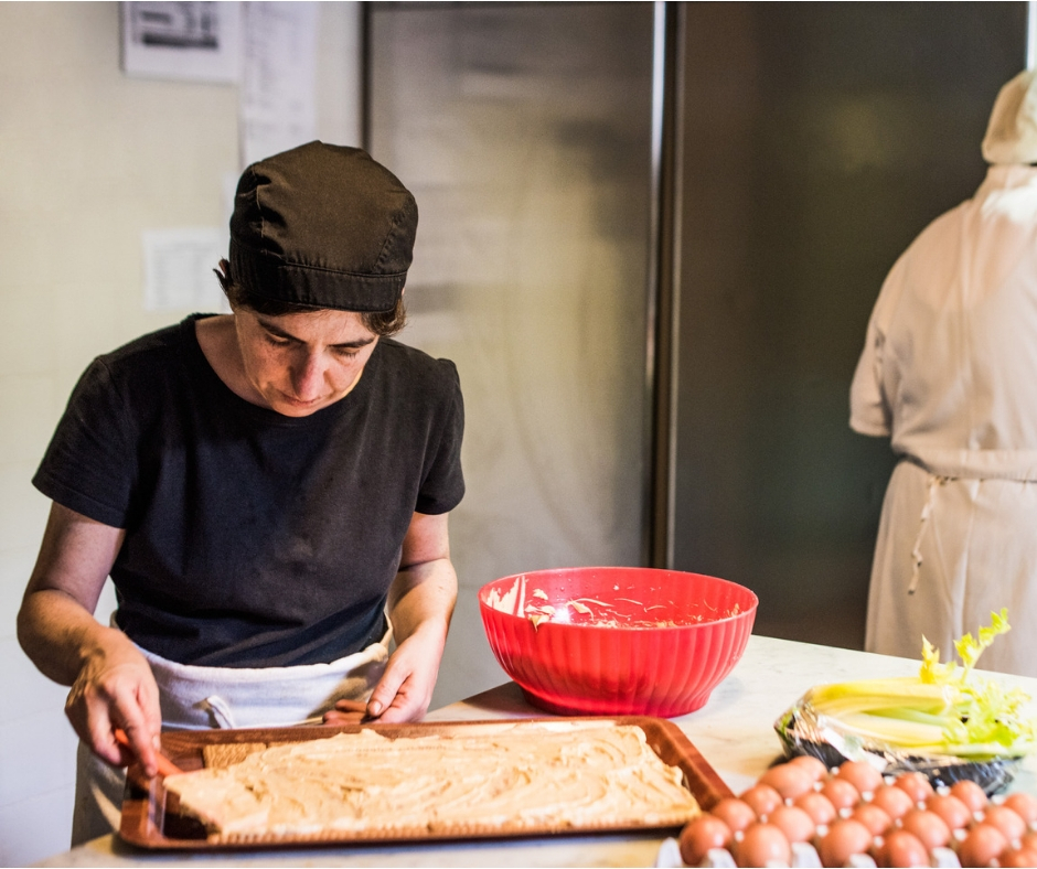 Chef Apprentice and Chef preparing a meal in the kitchen