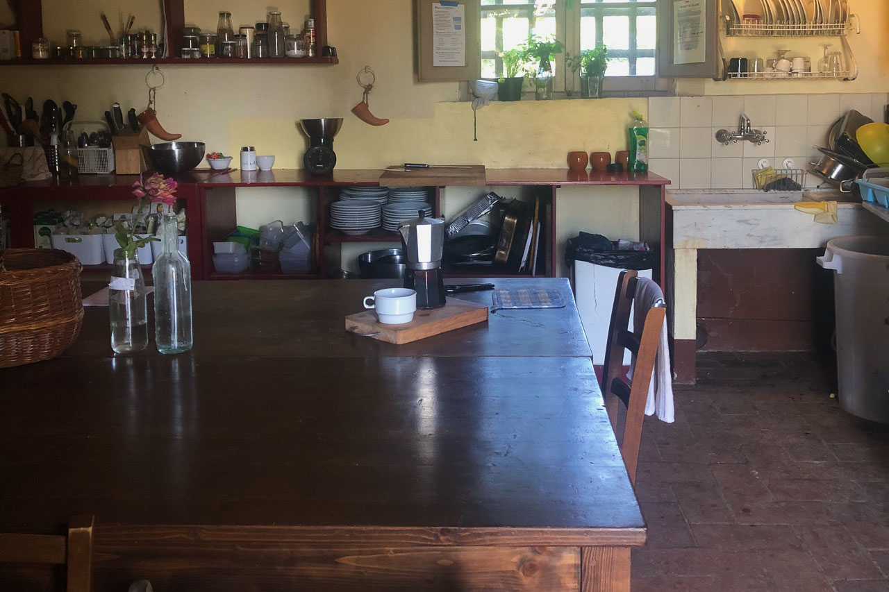 Brown wood dining table in the farm intern kitchen.