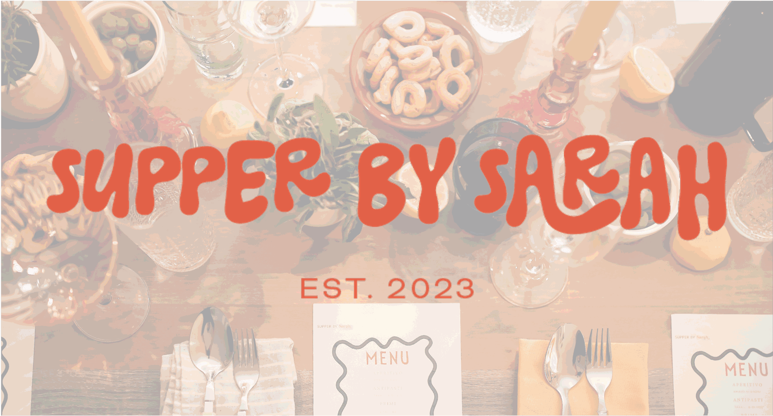 The logo for Supper by Sarah overlaid on a photo of a Supper by Sarah tablescape